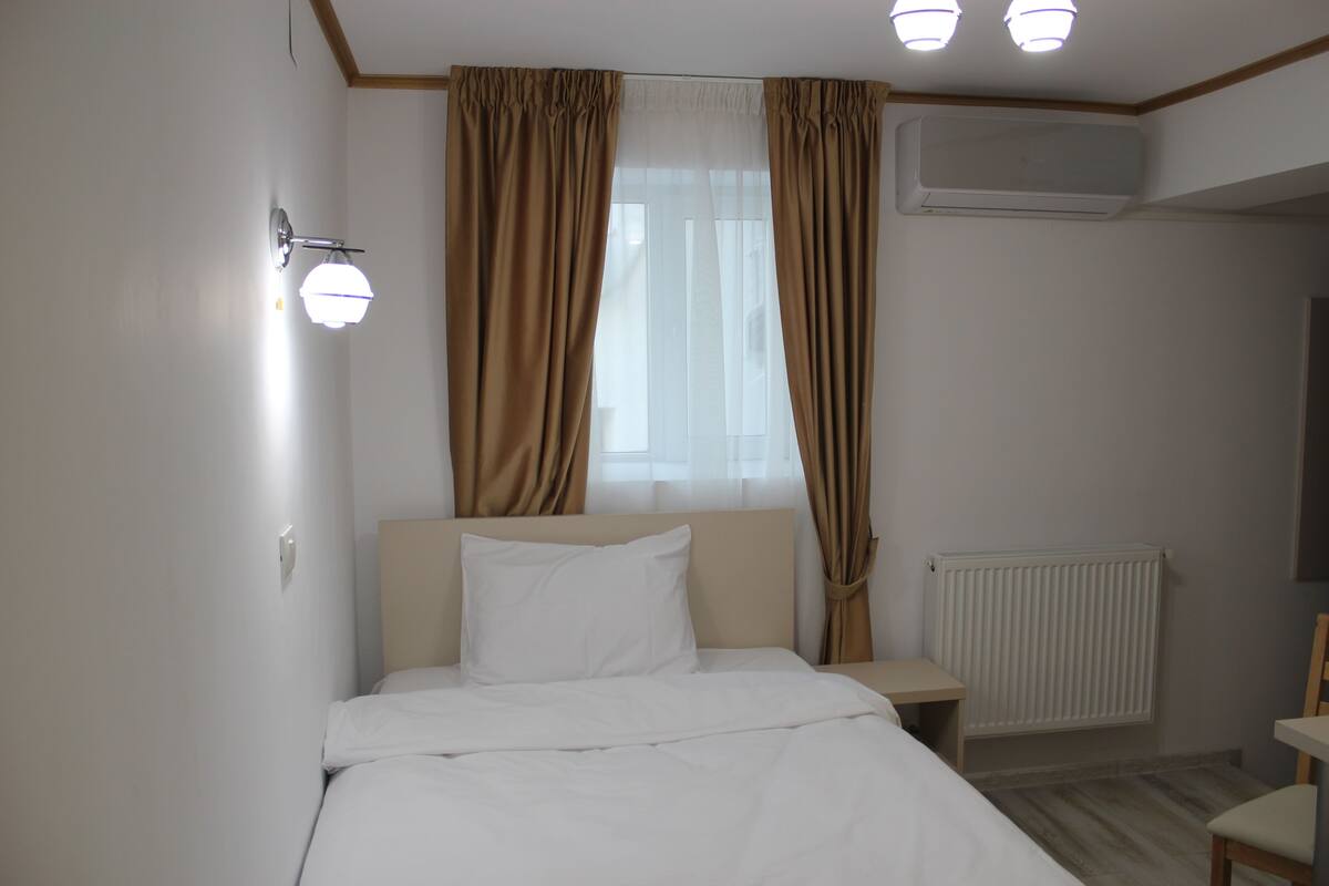 Select Comfort beds, blackout drapes, iron/ironing board, WiFi (free)