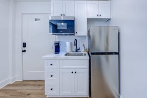 Fridge, microwave, coffee/tea maker, toaster