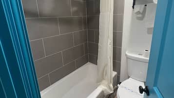 Premium Room, 1 King Bed | Bathroom | Bathtub, deep soaking tub, hair dryer, towels