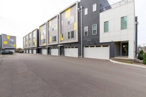 A multi-story parking garage with multiple levels and a flat roof. - The Harmony of Music City (Nashville)