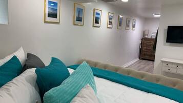 1 bedroom, desk, iron/ironing board, travel crib