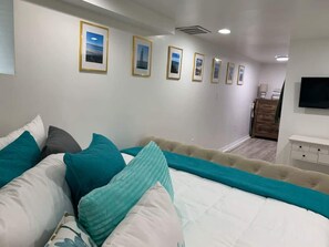 1 bedroom, desk, iron/ironing board, travel crib