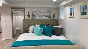 1 bedroom, desk, iron/ironing board, travel crib