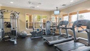 A gym with treadmills, weight machines, and exercise balls. - 1Pool Home Water Park Disney 2 m Universal Sea World! By Mystic Dunes golf ! (Kissimmee)