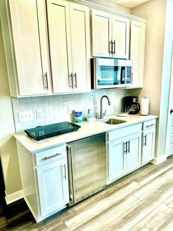 Fridge, microwave, stovetop, coffee/tea maker