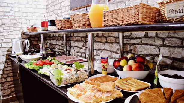A buffet with various food items including salads, fruits, and bread. - Darchi Hotel (Tbilisi)