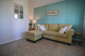 Living area - This lovely four-bedroom oceanfront home, “Holden Sunshine,” has amazing views of the Atlantic! (Holden Beach)