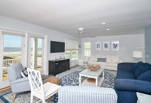 Enjoy the ocean view from the large window in this stylish living room.