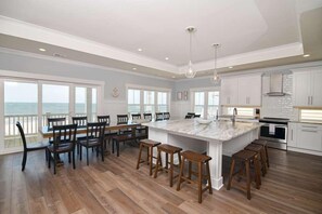 Fridge, microwave, oven, stovetop - Hobbs Realty - Glad you're "Knot At Work" in this oceanfront home with a heatable pool and elevator (Holden Beach)