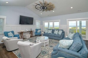 TV, foosball - Hobbs Realty - "Coast is Clear," an oceanfront home with a heatable pool, hot tub, and elevator. (Holden Beach)