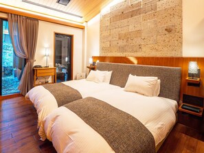 A double bed with a headboard, bedside tables, a lamp, and a view of the outdoors. - NIKKO-NISHIMACHICLUB A LA TOUTO (Nikko)