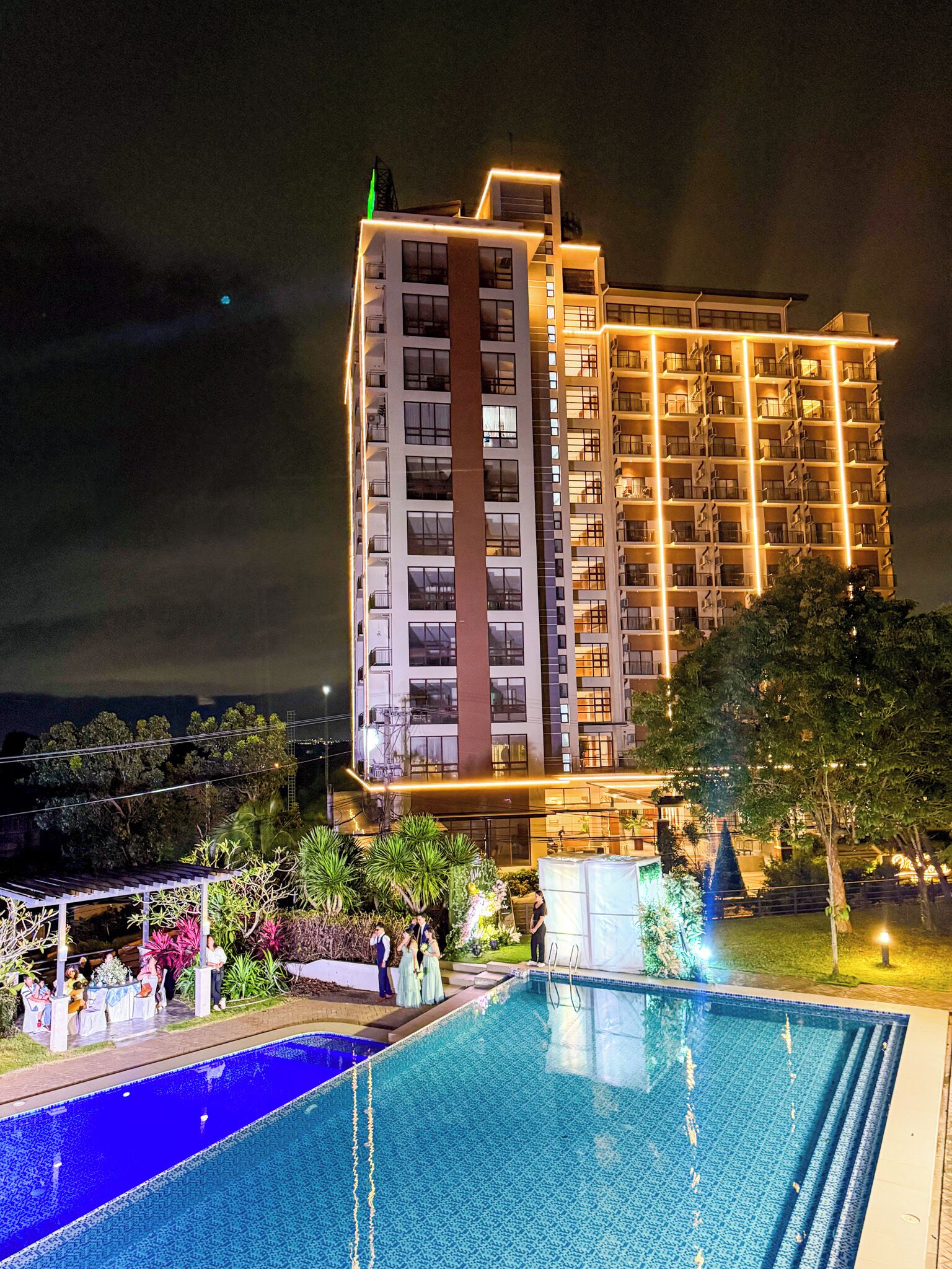 Outdoor pool, pool umbrellas, lifeguards on site