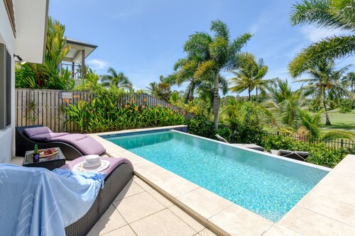 Private family home in gated estate overlooking golf course with heated pool