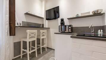 Fridge, microwave, stovetop, coffee/tea maker