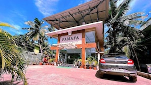 A building with a sign reading "FAMAPA" and a parked car in front. - Famafa Beach Resort (Arambol)