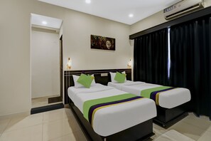 Deluxe Room | Desk, iron/ironing board, bed sheets - Treebo Blueberry Inn (Bengaluru)