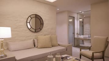 A modern living room with a beige sofa, a round mirror, a coffee table with books and vases, and a chair.