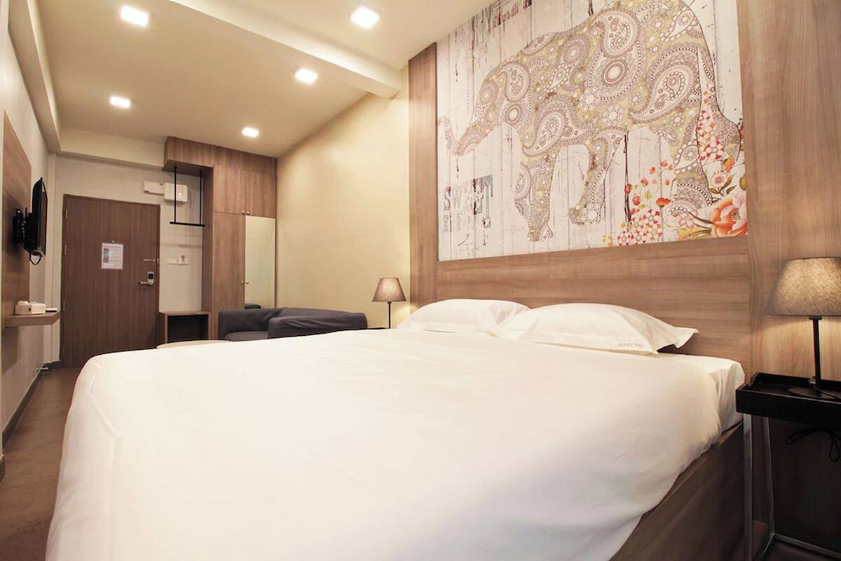 Minibar, desk, bed sheets