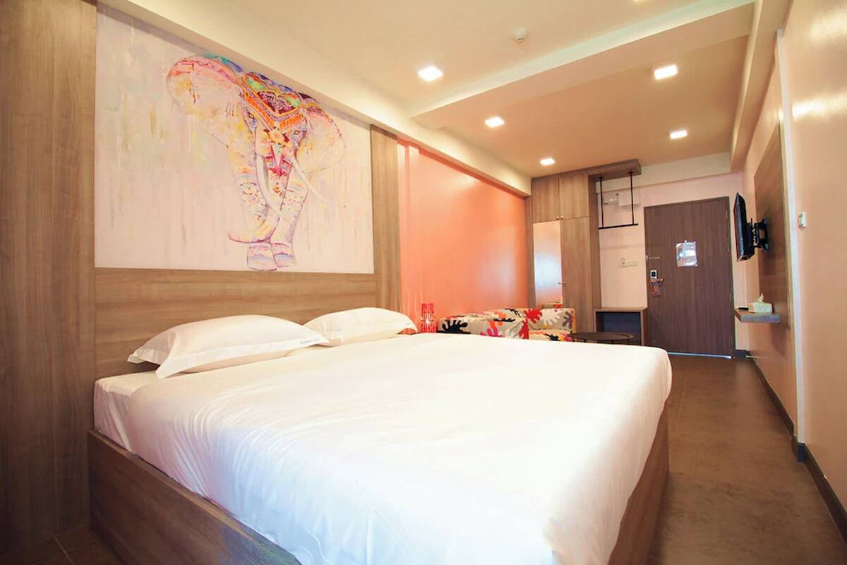 Minibar, desk, bed sheets