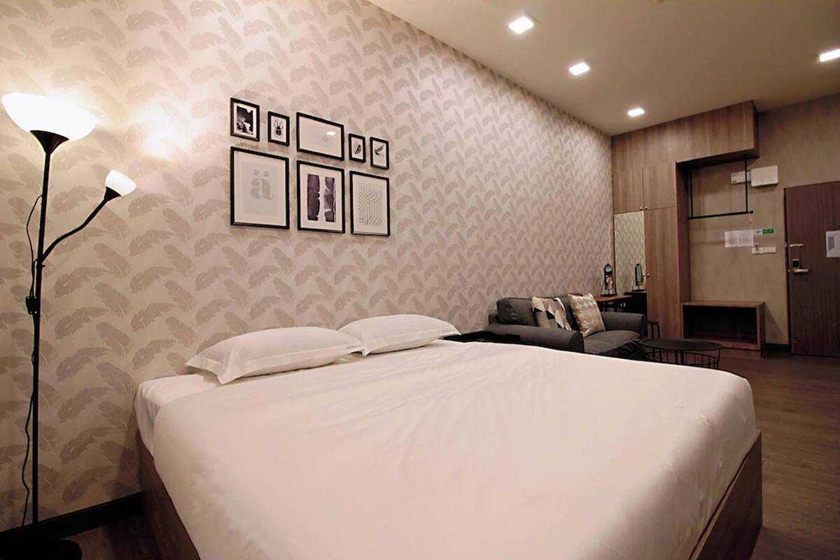 Minibar, desk, bed sheets