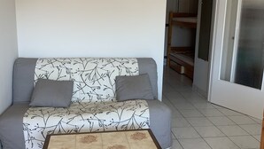 A small room with a sofa and a table.