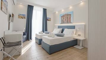 Premium bedding, down comforters, pillowtop beds, in-room safe