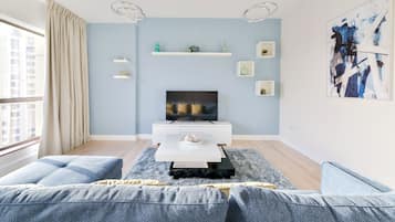 Deluxe 2BR Apartment - Marina View | Living area | 55-inch Smart TV with cable channels, TV