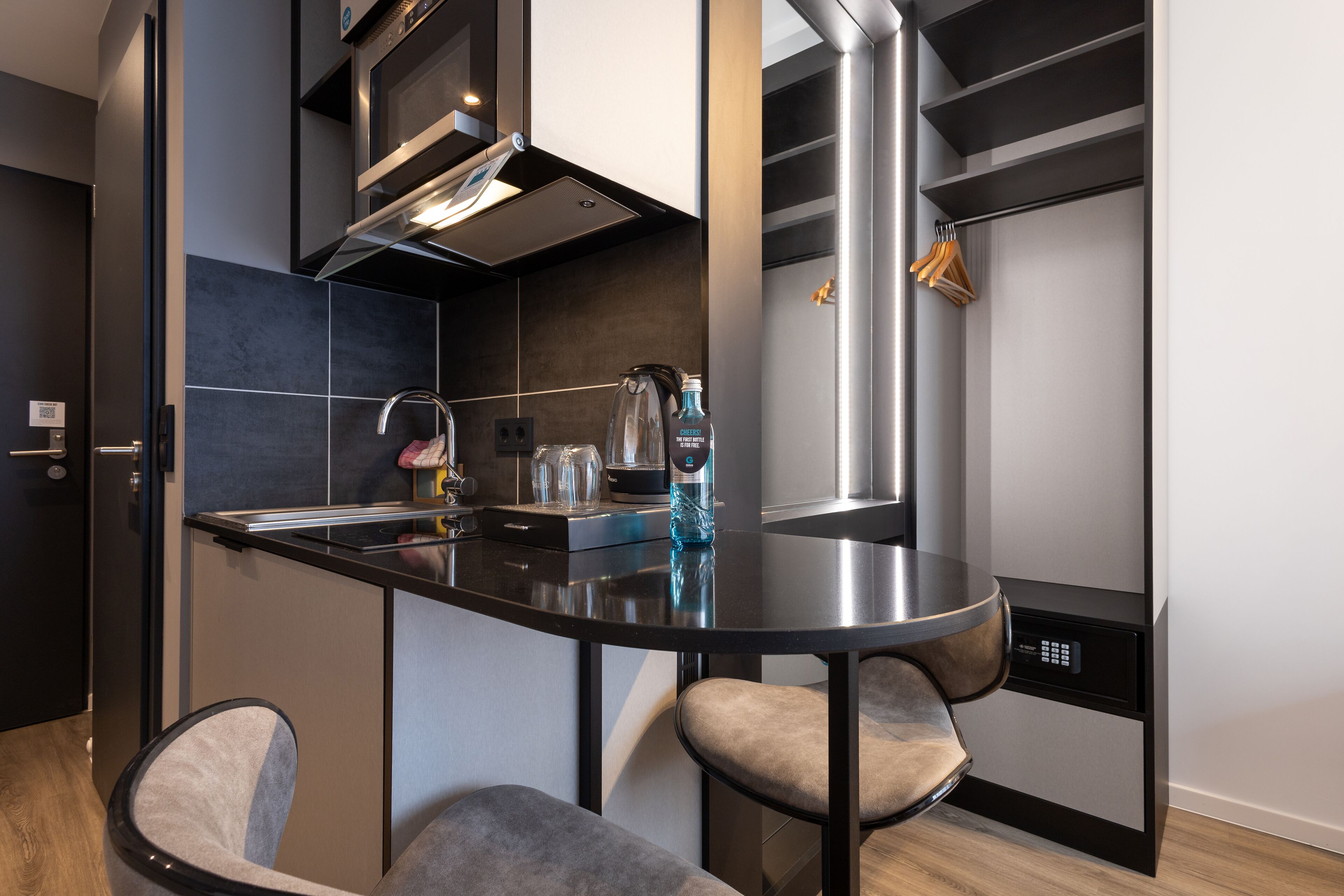 A modern kitchen with a central island, built-in appliances, and a sleek design.