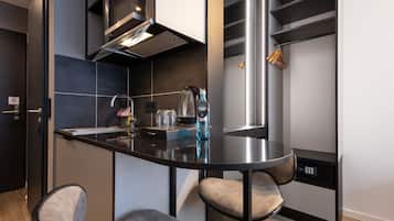A modern kitchen with a central island, built-in appliances, and a sleek design.