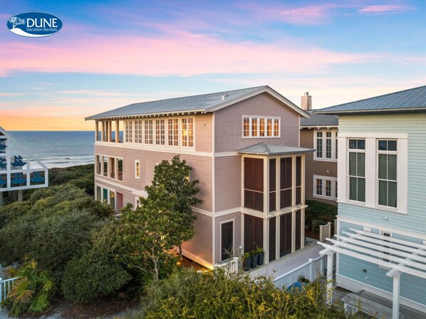 Enjoy scenic views from the spacious balcony area, surrounded by lush greenery and the ocean.