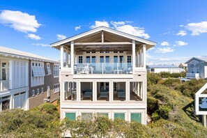 Enjoy expansive ocean views from the upper-floor balcony of this beachfront property.