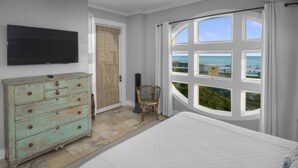 A bedroom with a bed, a dresser, a chair, and a TV. - Amazing Gulf Views 425a Watersound Crossings 3br Steps To Beach And Pool! 3 Bedroom Condo by RedAwning (Santa Rosa Beach)
