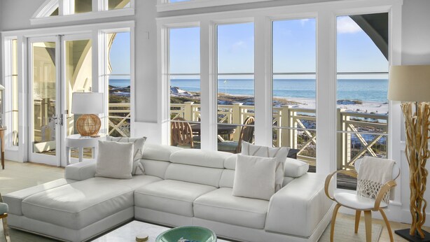 A spacious living room with a white sectional sofa, a marble coffee table, and a view of the beach through large windows. - Amazing Gulf Views 425a Watersound Crossings 3br Steps To Beach And Pool! 3 Bedroom Condo by RedAwning (Santa Rosa Beach)