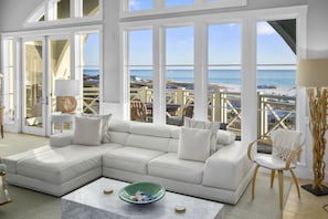 A spacious living room with a white sectional sofa, a marble coffee table, and a view of the beach through large windows. - Amazing Gulf Views 425a Watersound Crossings 3br Steps To Beach And Pool! 3 Bedroom Condo by RedAwning (Santa Rosa Beach)
