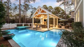A backyard with a swimming pool, a covered patio area, and a dining setup. - 'mirasol House' Pool + Golf Cart Watercolor, Fl 4br/4ba/bonus Bunk -- Sleeps 12 4 Bedroom Home by RedAwning (Santa Rosa Beach)