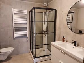 Shower, hair dryer, towels, soap