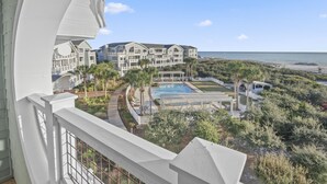 A resort with a pool, palm trees, and a beach view. - amazing Gulf Views 420b Watersound Crossings 3br, Corner Unit 3 Bedroom Condo by RedAwning (Santa Rosa Beach)