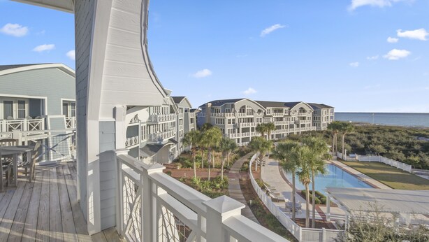 A resort with a pool, a deck, and a view of the ocean. - amazing Gulf Views 420b Watersound Crossings 3br, Corner Unit 3 Bedroom Condo by RedAwning (Santa Rosa Beach)