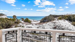 A coastal view with a sandy beach, sparse vegetation, and a clear blue sky. - GULF VIEWS from ALL Bedrooms! 308 Compass Point 1 in WaterSound Short walk to the beach and pool 3 Condo by RedAwning (Santa Rosa Beach)