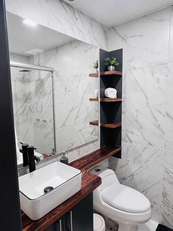 Shower, hair dryer, towels, soap