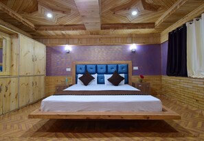 A wooden-themed bedroom with a bed, headboard, and built-in wardrobe.