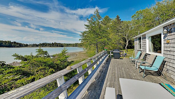 A wooden deck with outdoor seating overlooking a lake. - Nest On Mount Desert Isle w Beach - 8 Mi to Acadia (Mt Desert)