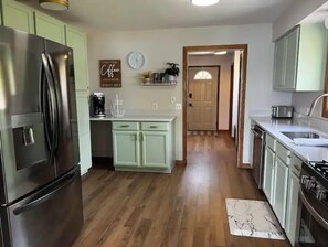 Fridge, microwave, oven, stovetop - Remodeled Lake House Featuring Sauna, Sleeps 12 (Muskegon)