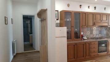 Comfort Apartment | Private kitchen | Full-sized fridge, microwave, espresso maker, cookware/dishes/utensils