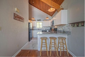 Fridge, microwave, oven, stovetop - Waterfront home with deep water, skiing/tubing coves, firepit, pool table, SUP (Moneta)