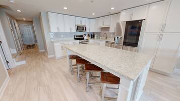 Condo, 6 Bedrooms | Private kitchen | Fridge, oven, coffee/tea maker, toaster