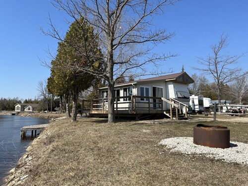 #0 Enjoy a waterfront view from your own trailer with a deck & sunroom