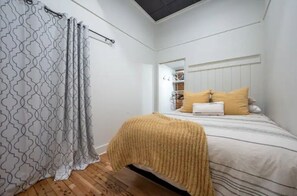 1 bedroom, desk, iron/ironing board, travel crib