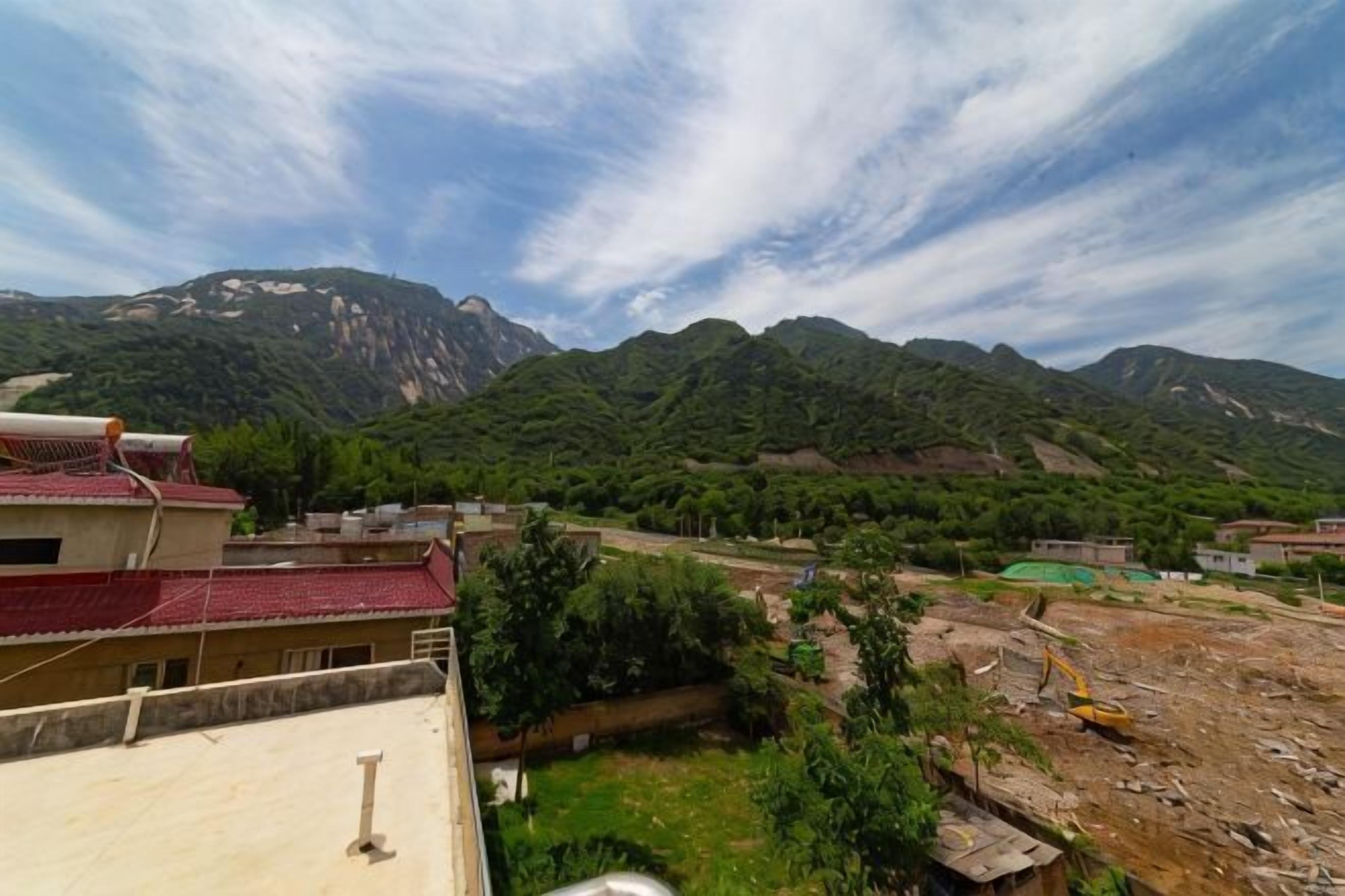 A mountainous landscape with buildings and construction.
