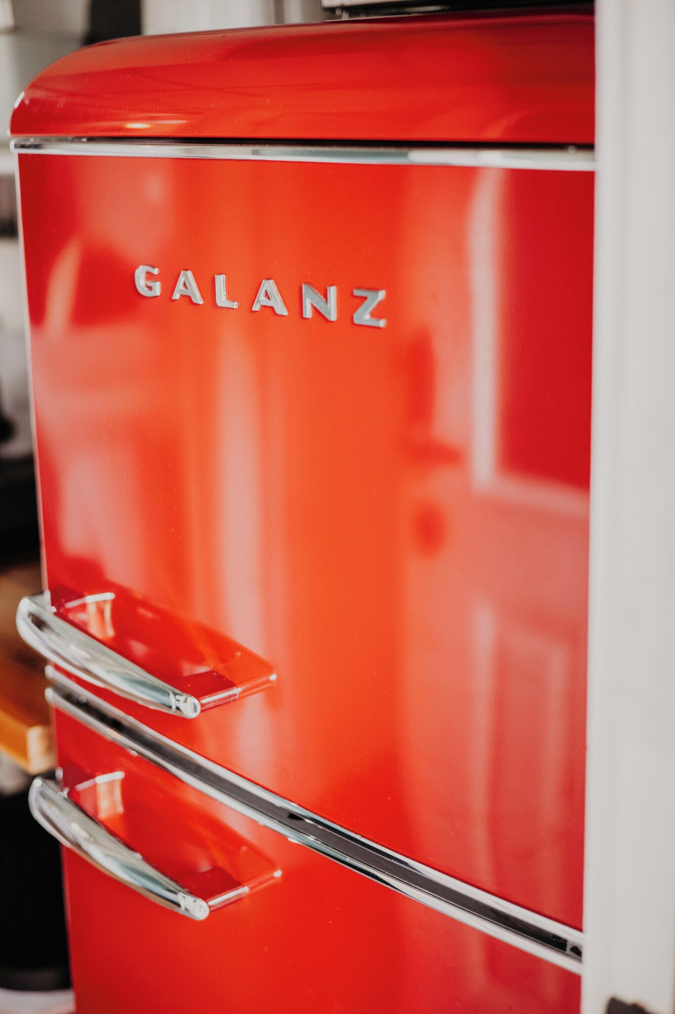 A red vintage appliance with the brand name "GALANZ" and three chrome handles.